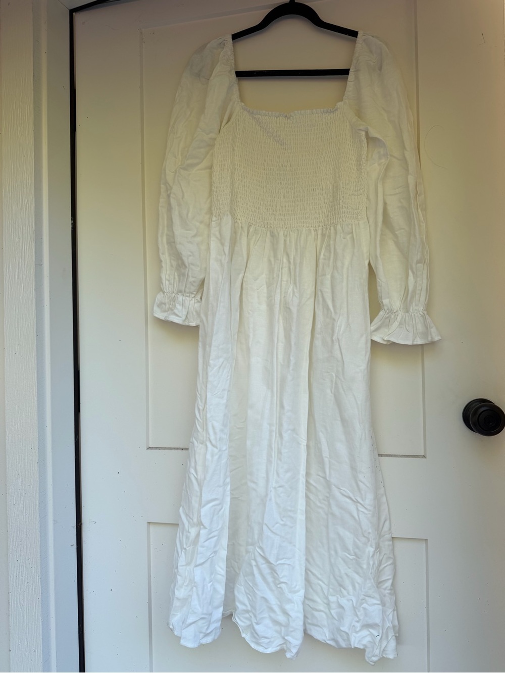 white midi dress with smocked bodice and balloon sleeves